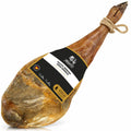 Cured spanish serrano ham with a label on a white background