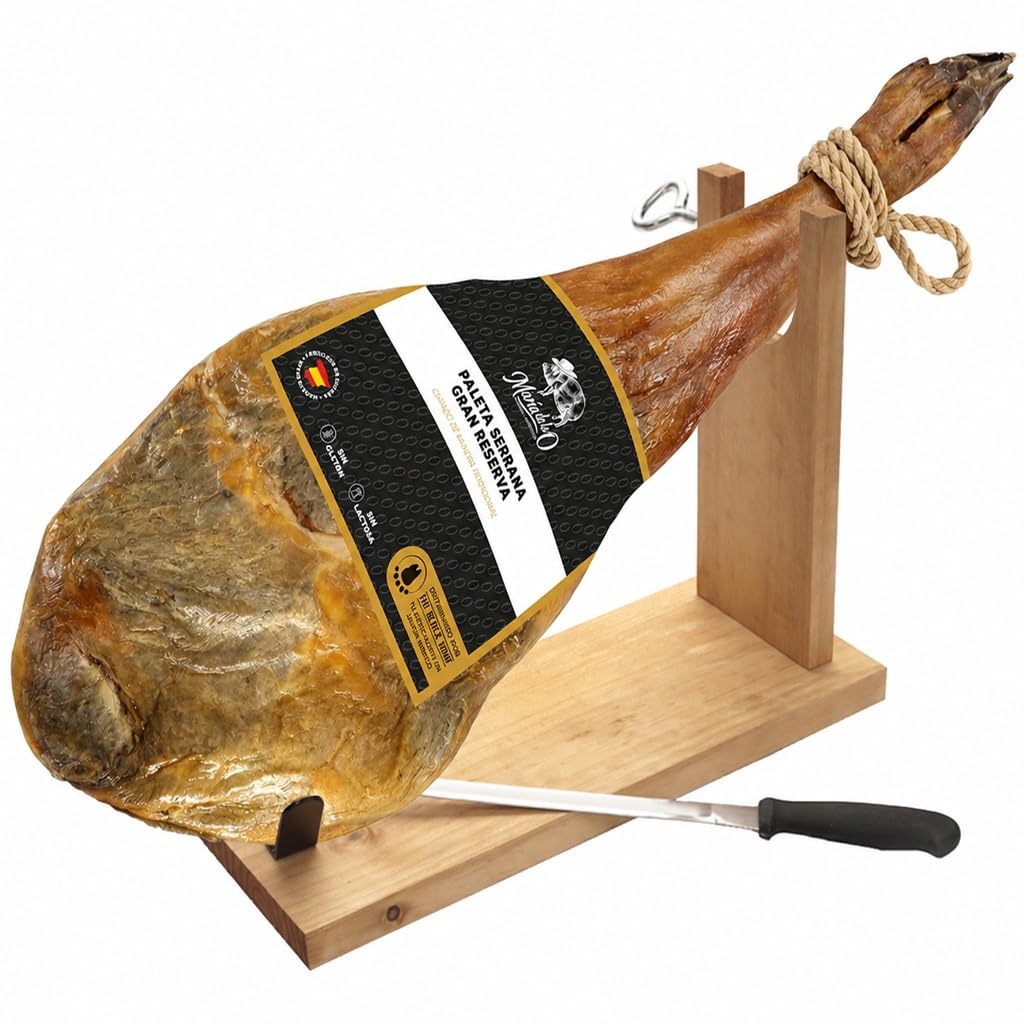 Cured serrano ham with a label on a wooden stand with a knife, on a white background