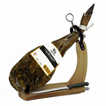 Spanish ham on a wooden stand with a knife, branded 'Jamon Ibérico de Cebo', on a white background